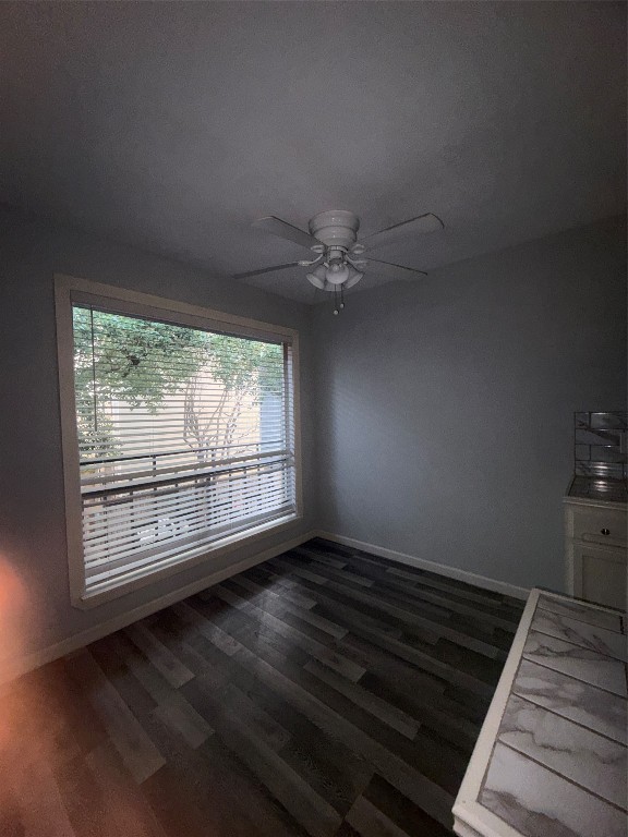 4626 Bell Street, Unit 6 Houston, TX 77023 - Photo 3 of 11 an empty room with wooden floor fan and windows