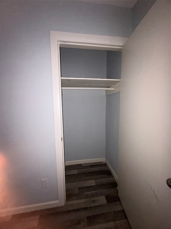 4626 Bell Street, Unit 6 Houston, TX 77023 - Photo 7 of 11 a view of walk in closet with wooden floor