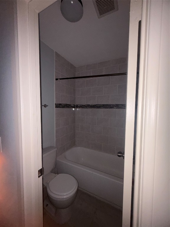 4626 Bell Street, Unit 6 Houston, TX 77023 - Photo 9 of 11 a bathroom with a granite countertop sink toilet and shower
