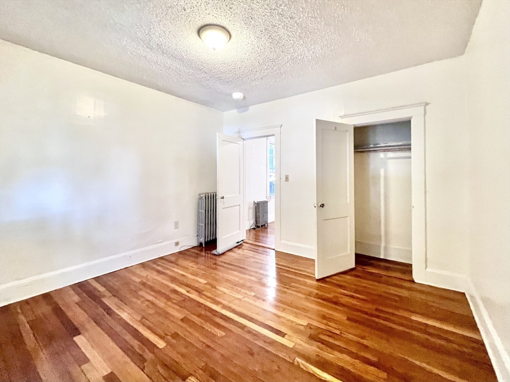 26 Chiswick Road, Unit 6 Boston, MA 02135 - Photo 15 of 31 wooden floor in an empty room