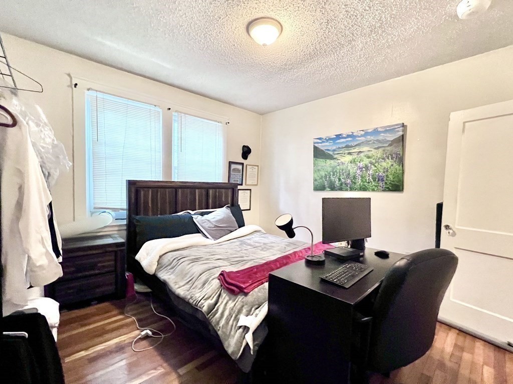 26 Chiswick Road, Unit 6 Boston, MA 02135 - Photo 25 of 31 a bedroom with a bed and a window