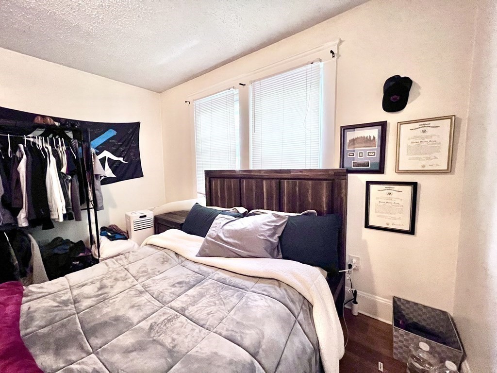 26 Chiswick Road, Unit 6 Boston, MA 02135 - Photo 26 of 31 a bedroom with bed and a window