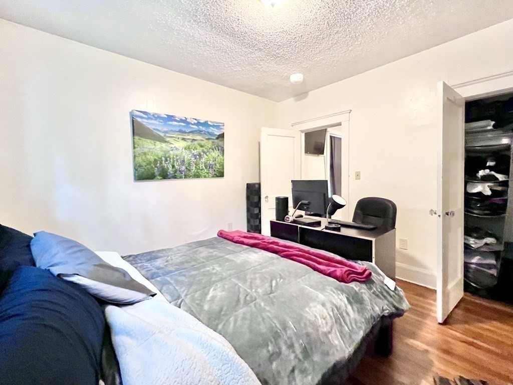 26 Chiswick Road, Unit 6 Boston, MA 02135 - Photo 28 of 31 a bedroom with a bed and a large window