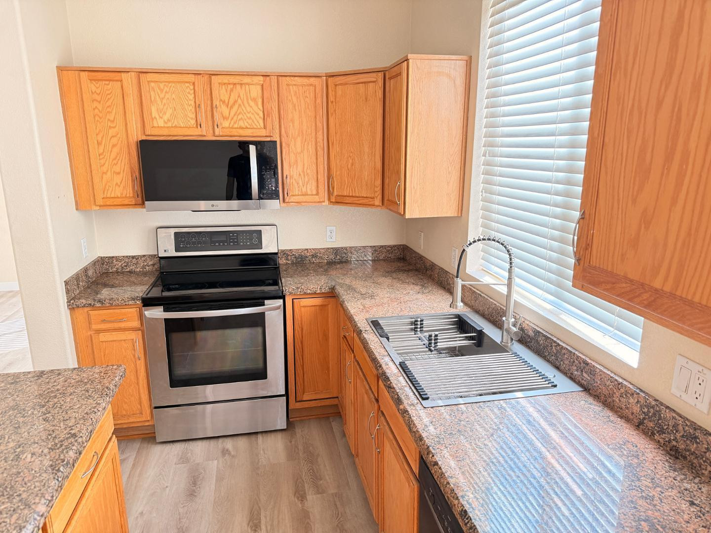 17640 North 17th Street Phoenix, AZ 85022 - Photo 7 of 21 a kitchen with a stove and a microwave