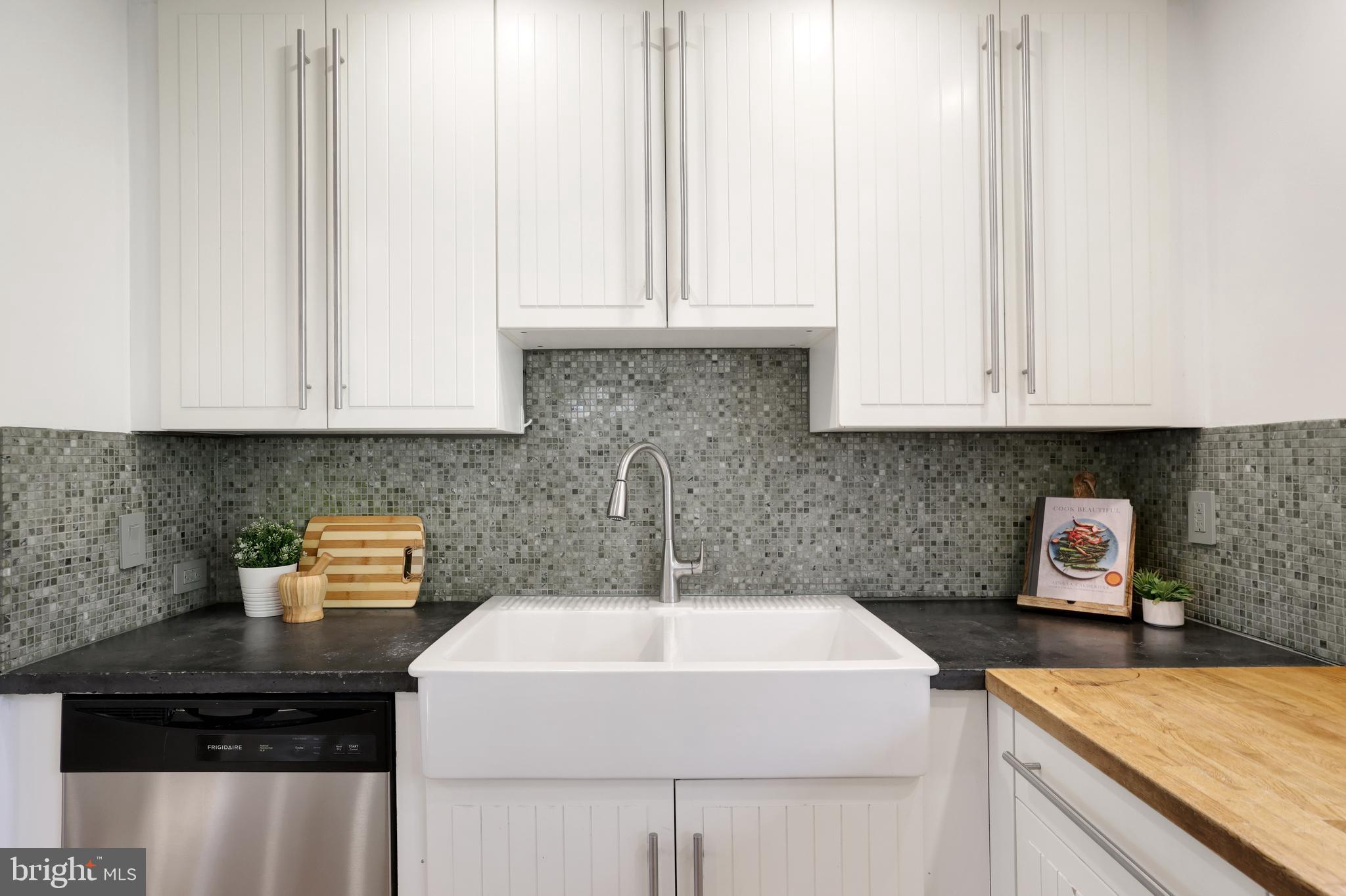 11812 Selfridge Road Silver Spring, MD 20906 - Photo 13 of 42 a kitchen with stainless steel appliances granite countertop a sink and a white cabinets