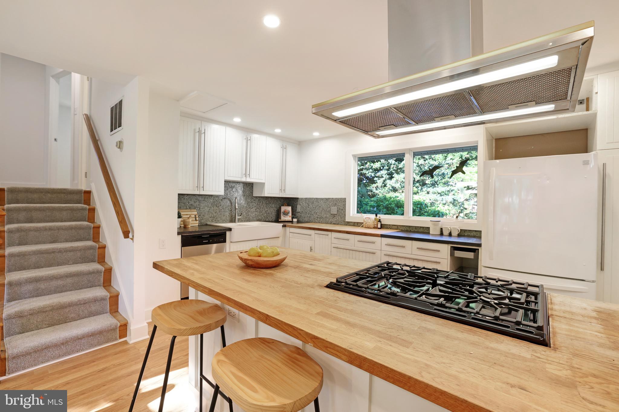 11812 Selfridge Road Silver Spring, MD 20906 - Photo 16 of 42 a kitchen with a table and chairs in it