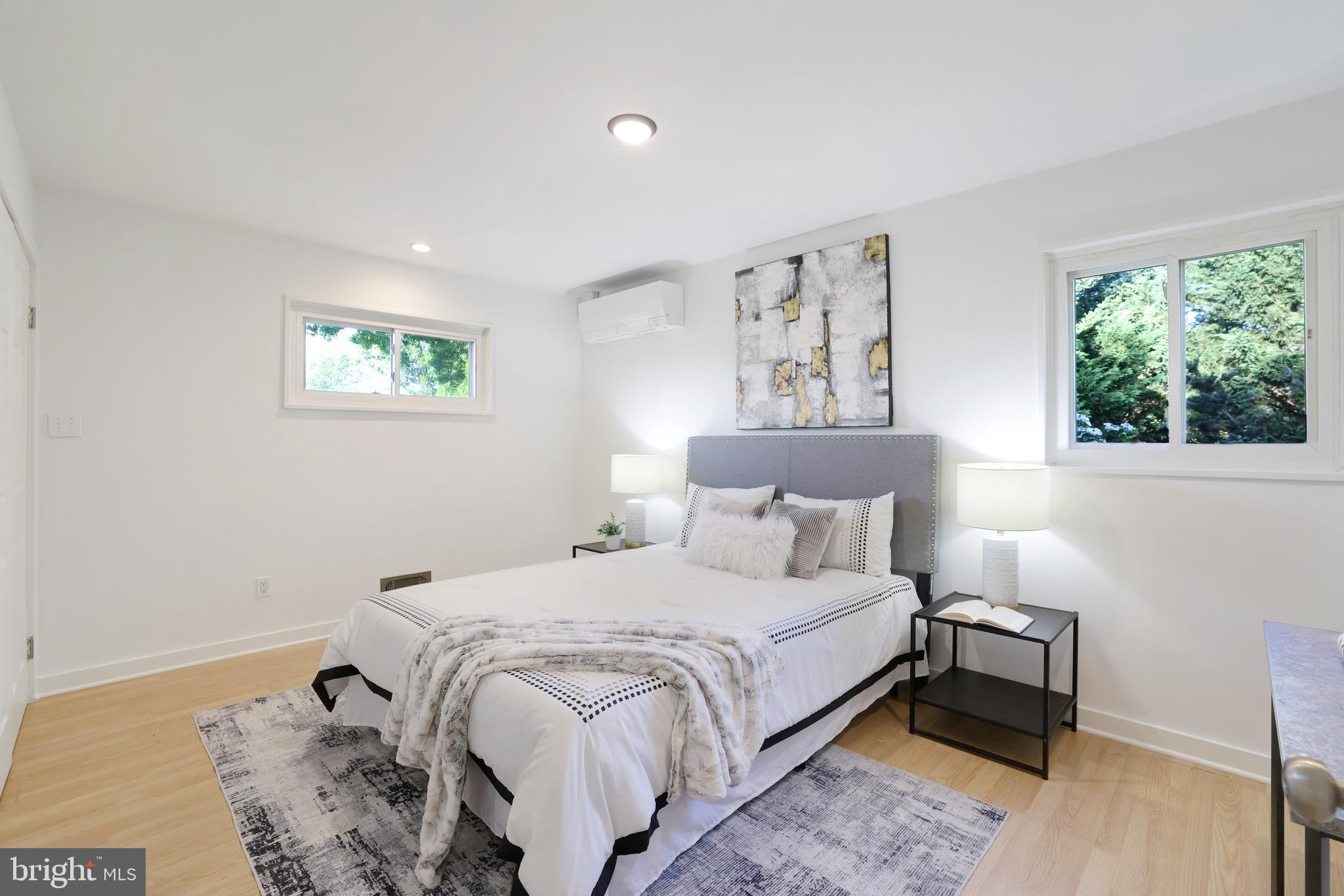 11812 Selfridge Road Silver Spring, MD 20906 - Photo 23 of 42 a bedroom with a bed and a painting on the wall