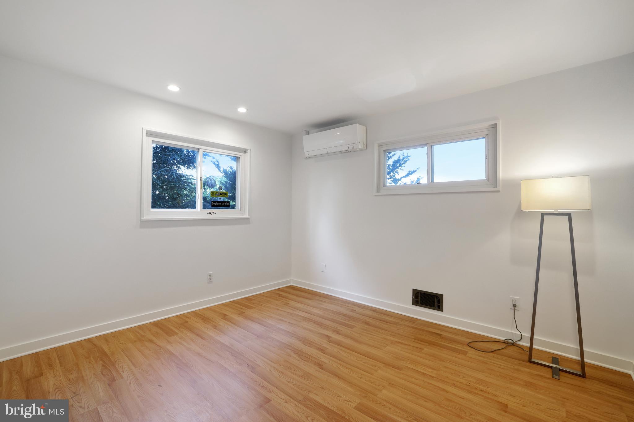 11812 Selfridge Road Silver Spring, MD 20906 - Photo 25 of 42 a view of empty room with wooden floor and window