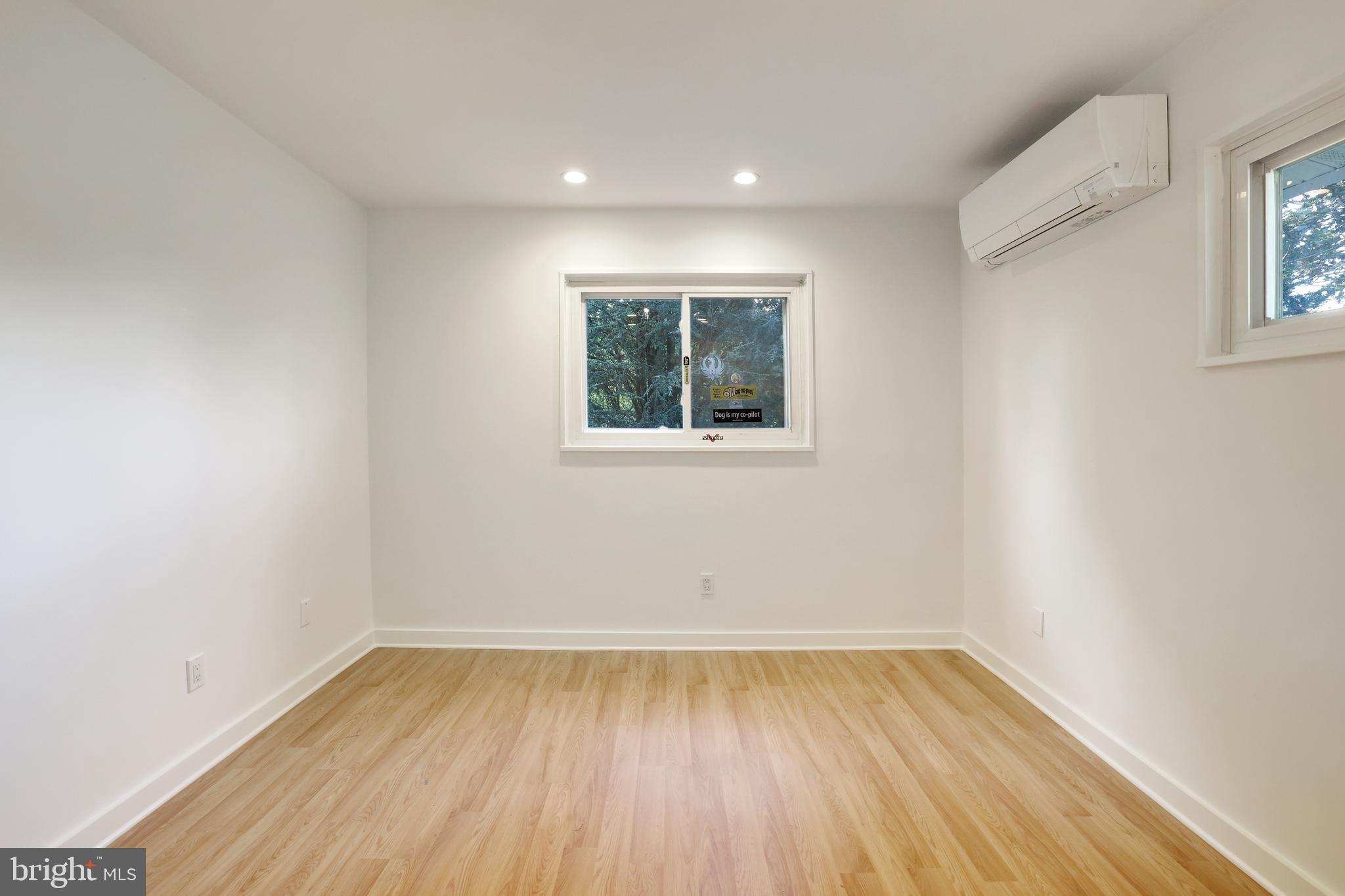 11812 Selfridge Road Silver Spring, MD 20906 - Photo 27 of 42 wooden floor in an empty room with a window