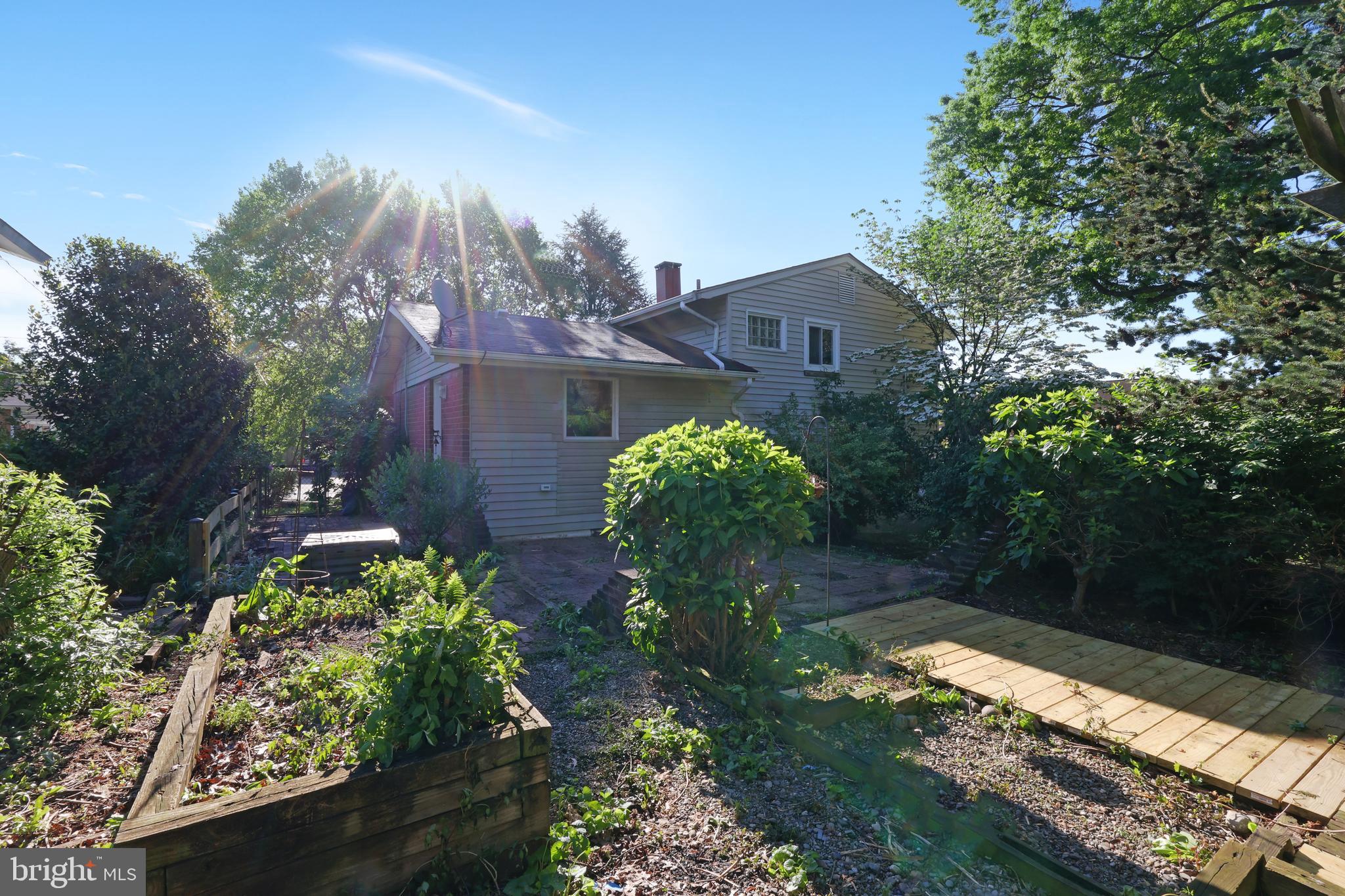 11812 Selfridge Road Silver Spring, MD 20906 - Photo 33 of 42 a backyard of a house with lots of green space