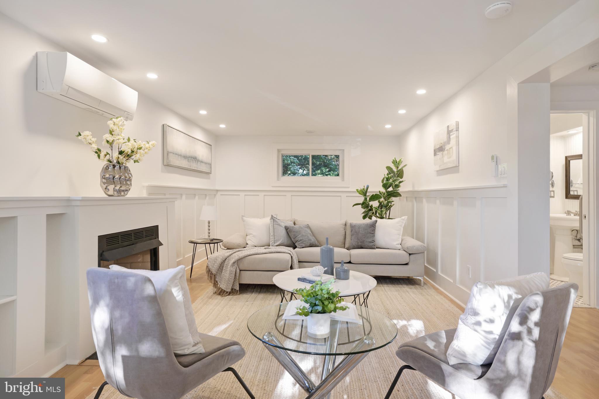 11812 Selfridge Road Silver Spring, MD 20906 - Photo 5 of 42 a living room with furniture potted plant and a fireplace
