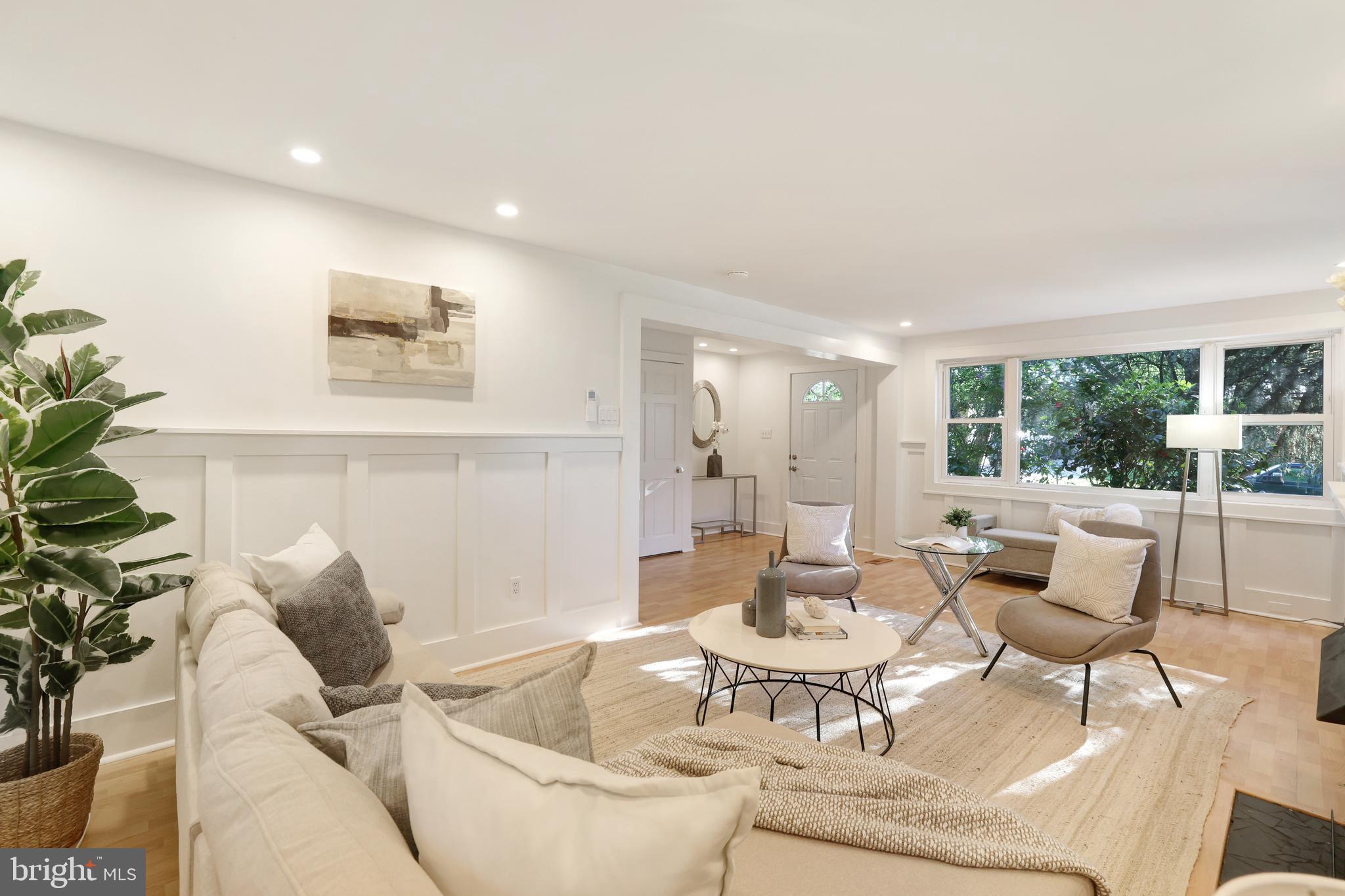 11812 Selfridge Road Silver Spring, MD 20906 - Photo 8 of 42 a living room with furniture and a large window