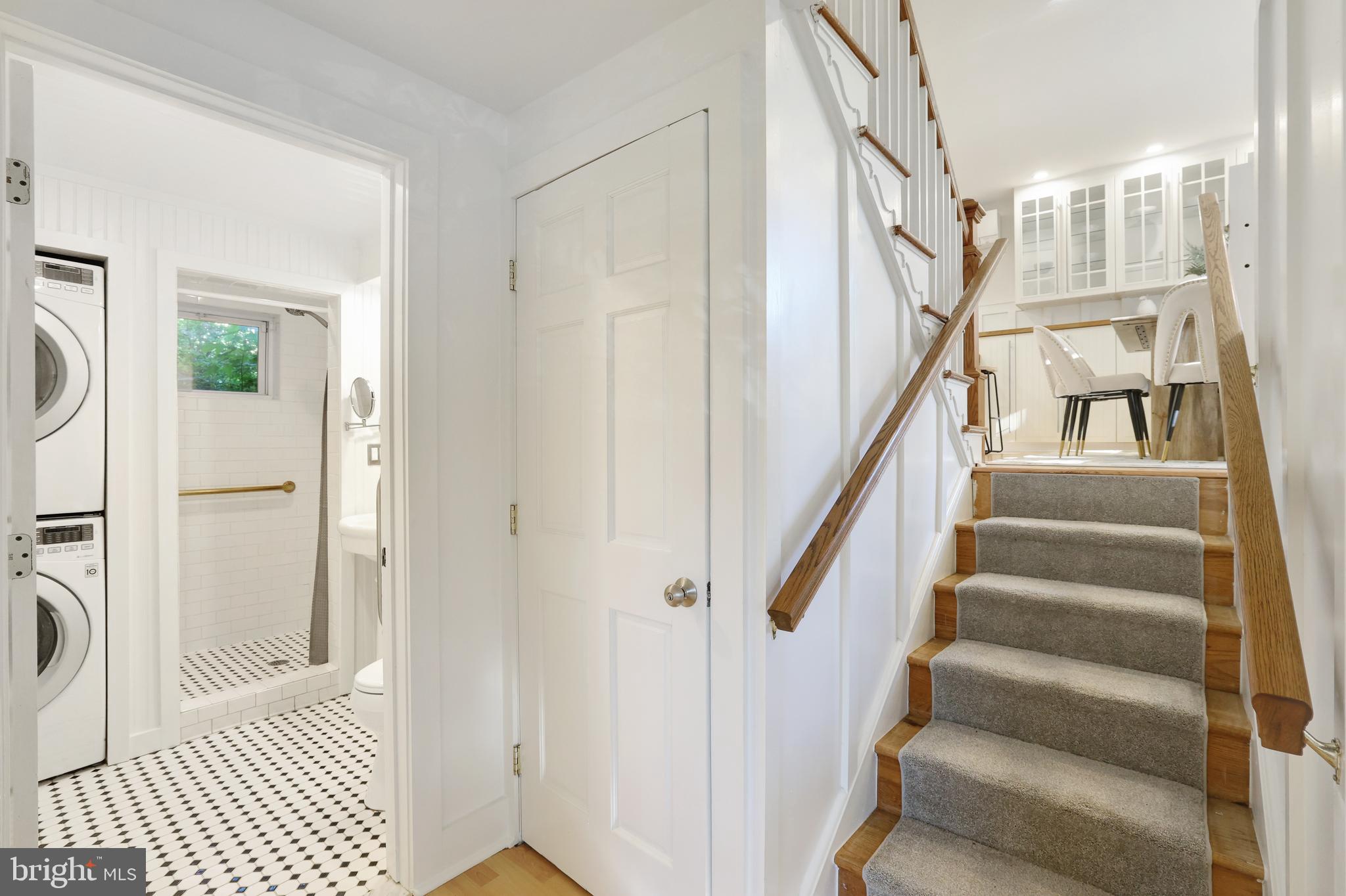 11812 Selfridge Road Silver Spring, MD 20906 - Photo 10 of 42 a view of staircase with lots of frames on wall and a shower