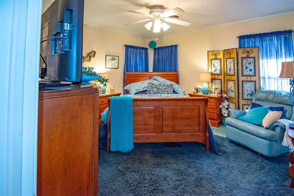 a bed room with a bed and a window