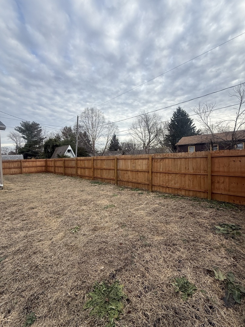 312 East 11th Street Georgetown, IL 61846 - Photo 20 of 25 a view of a yard with wooden fence