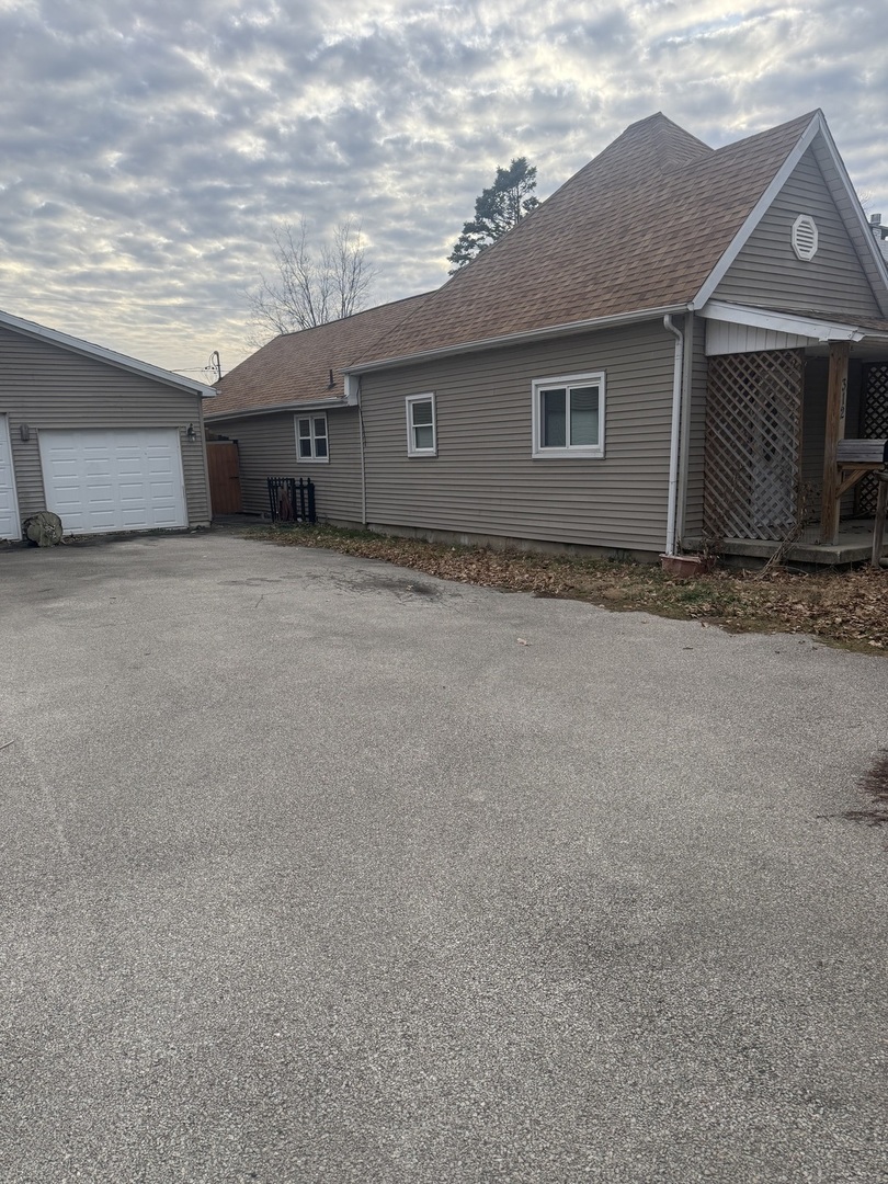 312 East 11th Street Georgetown, IL 61846 - Photo 24 of 25 a front view of a house with a yard and garage