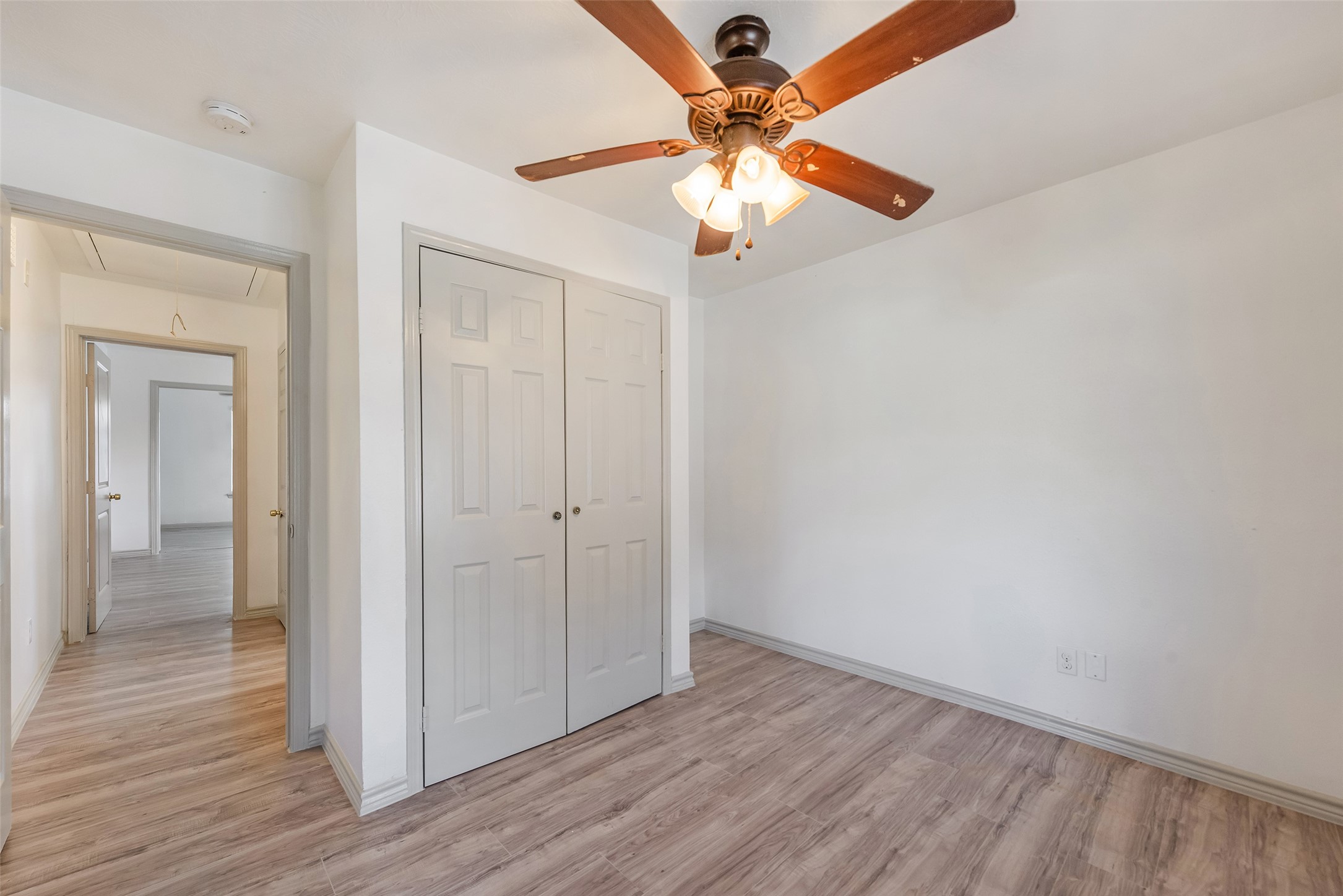 6402 West Montgomery Road, Unit A Houston, TX 77091 - Photo 20 of 23 wooden floor in an empty room with a window