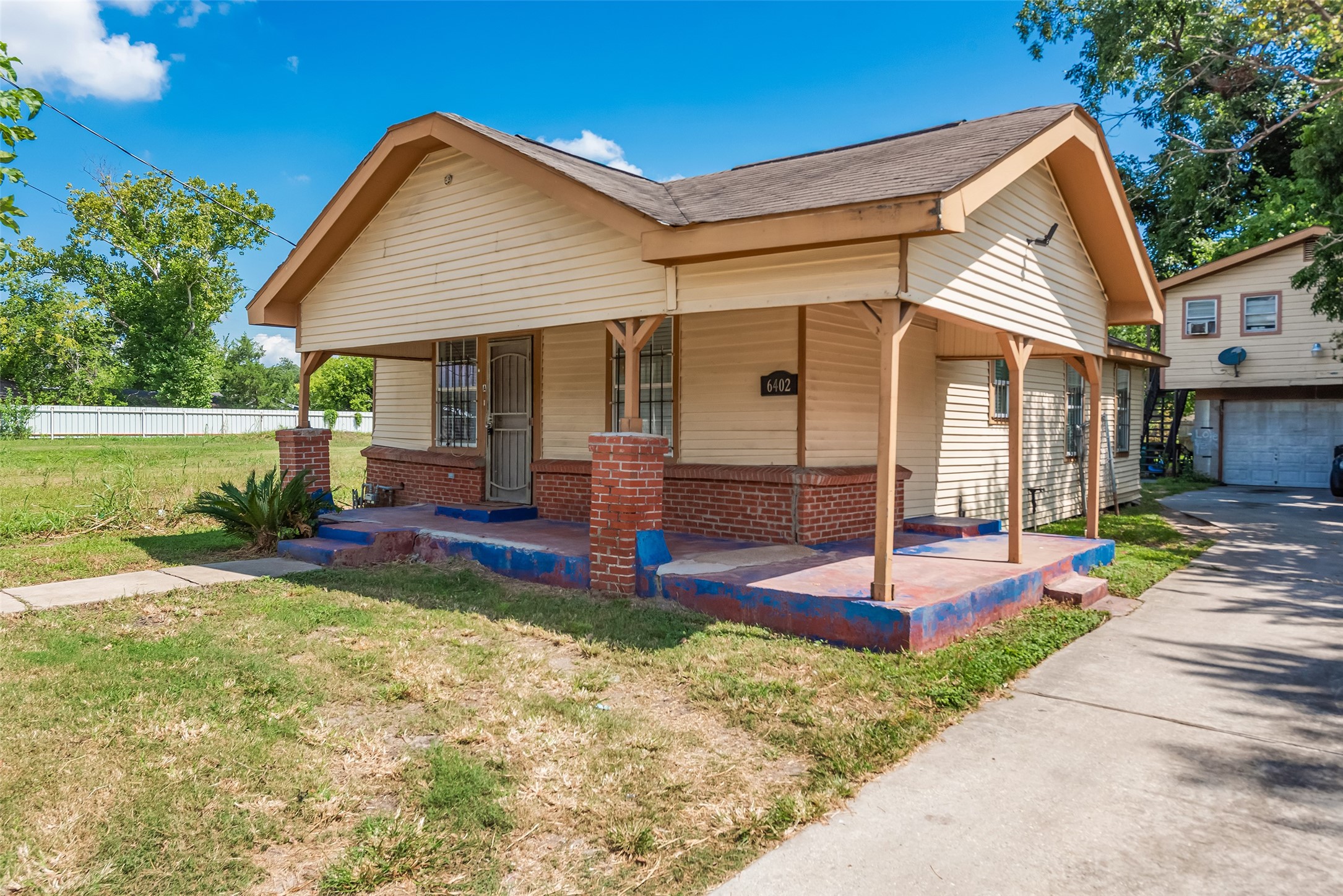 6402 West Montgomery Road, Unit A Houston, TX 77091 - Photo 2 of 23 a front view of a house with a yard