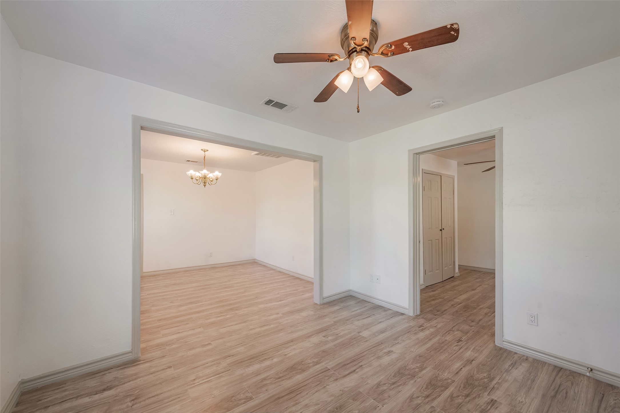 6402 West Montgomery Road, Unit A Houston, TX 77091 - Photo 5 of 23 wooden floor in an empty room with a window