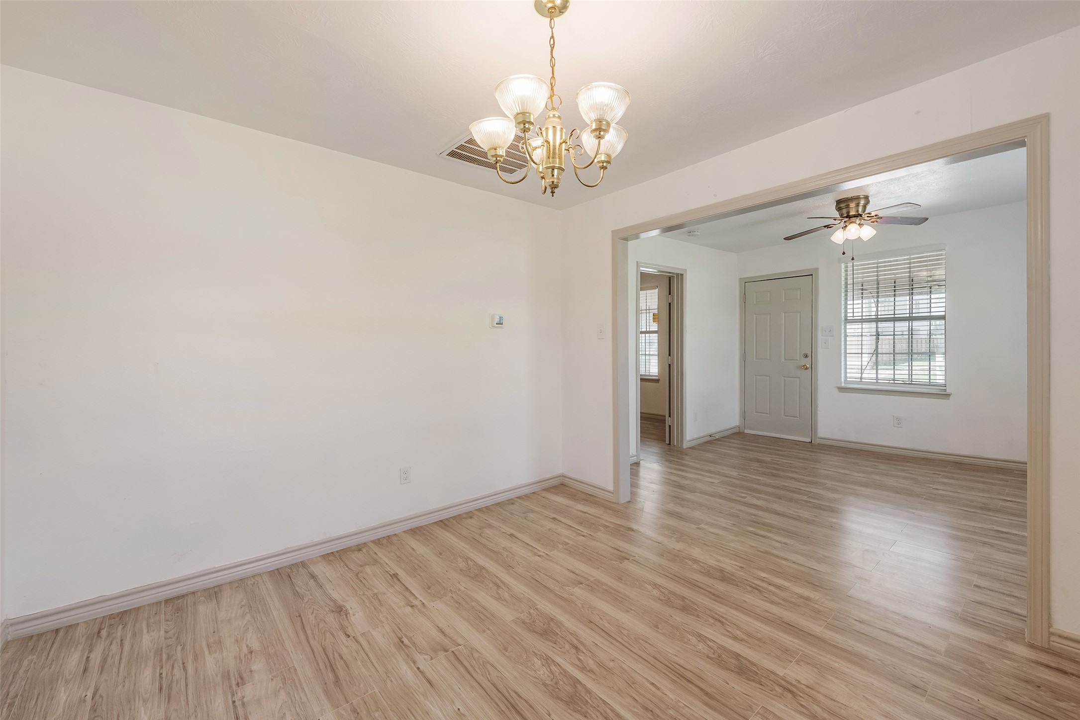 6402 West Montgomery Road, Unit A Houston, TX 77091 - Photo 8 of 23 a view of an empty room with wooden floor and a window