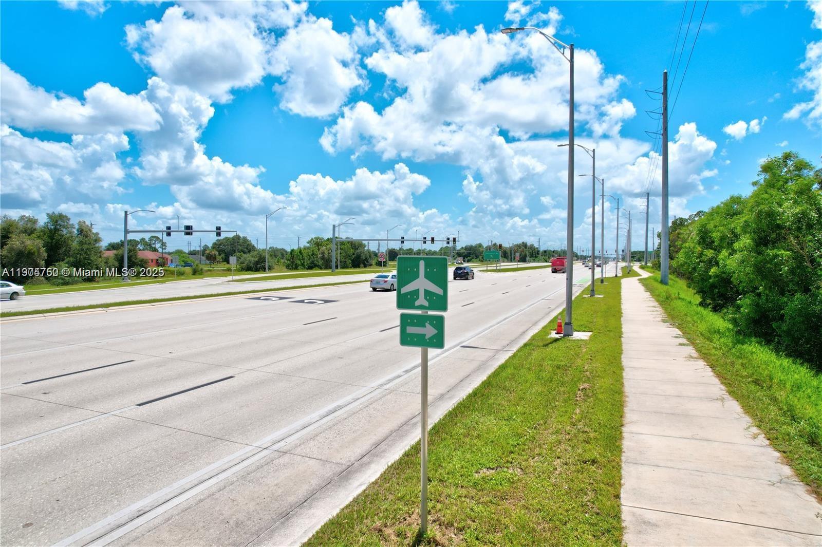 936-938 Countess Avenue Lehigh Acres, FL 33974 - Photo 12 of 24 a view of a pathway both side of building