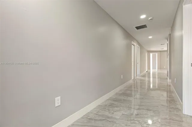 a view of kitchen with wooden floor