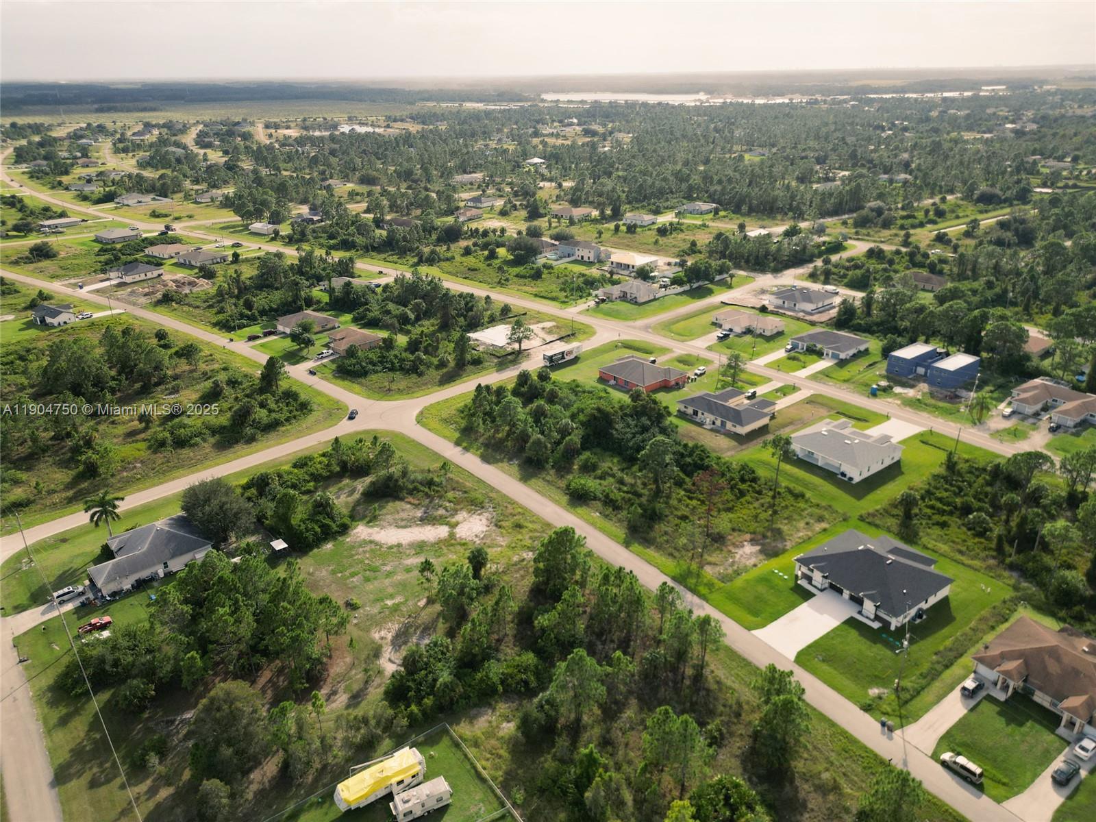 936-938 Countess Avenue Lehigh Acres, FL 33974 - Photo 7 of 24 an aerial view of residential houses with outdoor space and trees