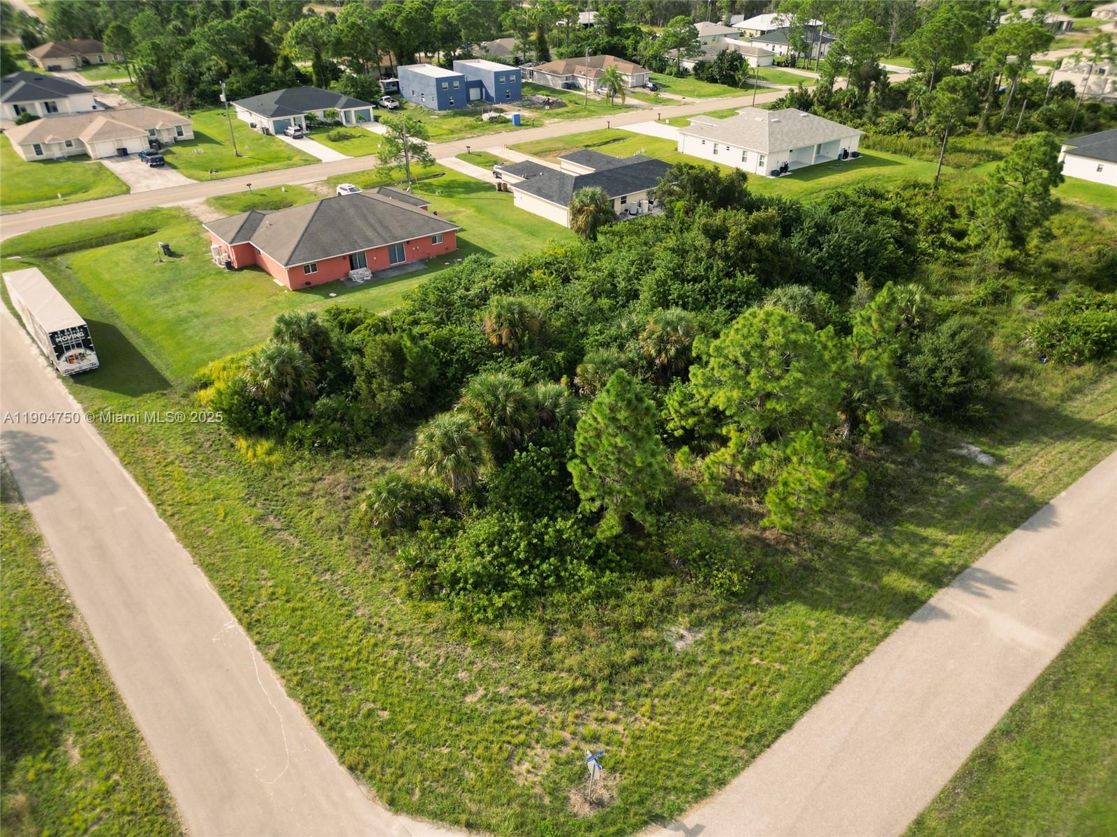 936-938 Countess Avenue Lehigh Acres, FL 33974 - Photo 8 of 24 a view of a swimming pool with a garden