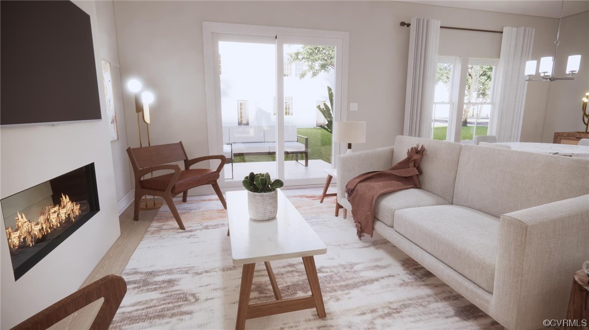 11301 Benton Pointe Way Chester, VA 23831 - Photo 4 of 12 a living room with furniture a flat screen tv and a fireplace