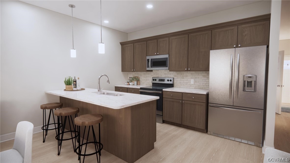 11301 Benton Pointe Way Chester, VA 23831 - Photo 5 of 12 a kitchen with a refrigerator a microwave a sink and cabinets