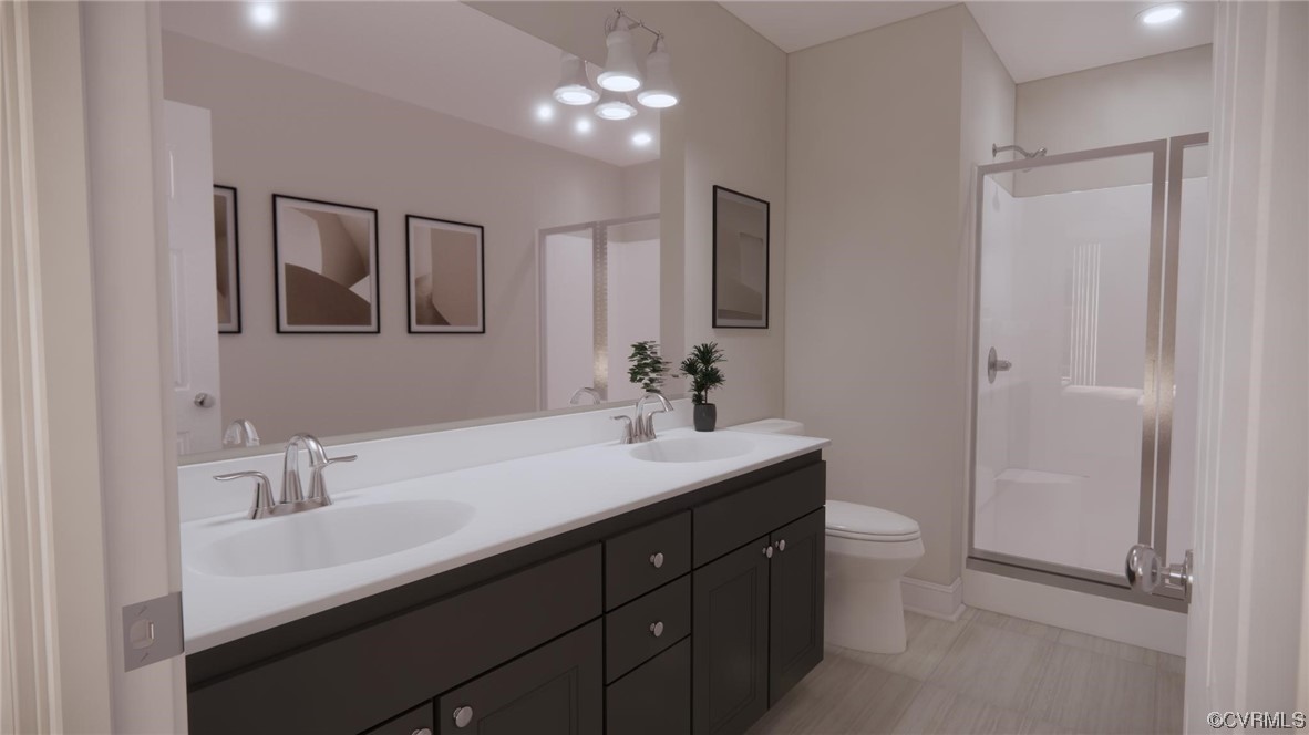 11301 Benton Pointe Way Chester, VA 23831 - Photo 9 of 12 a bathroom with a sink double vanity and a toilet