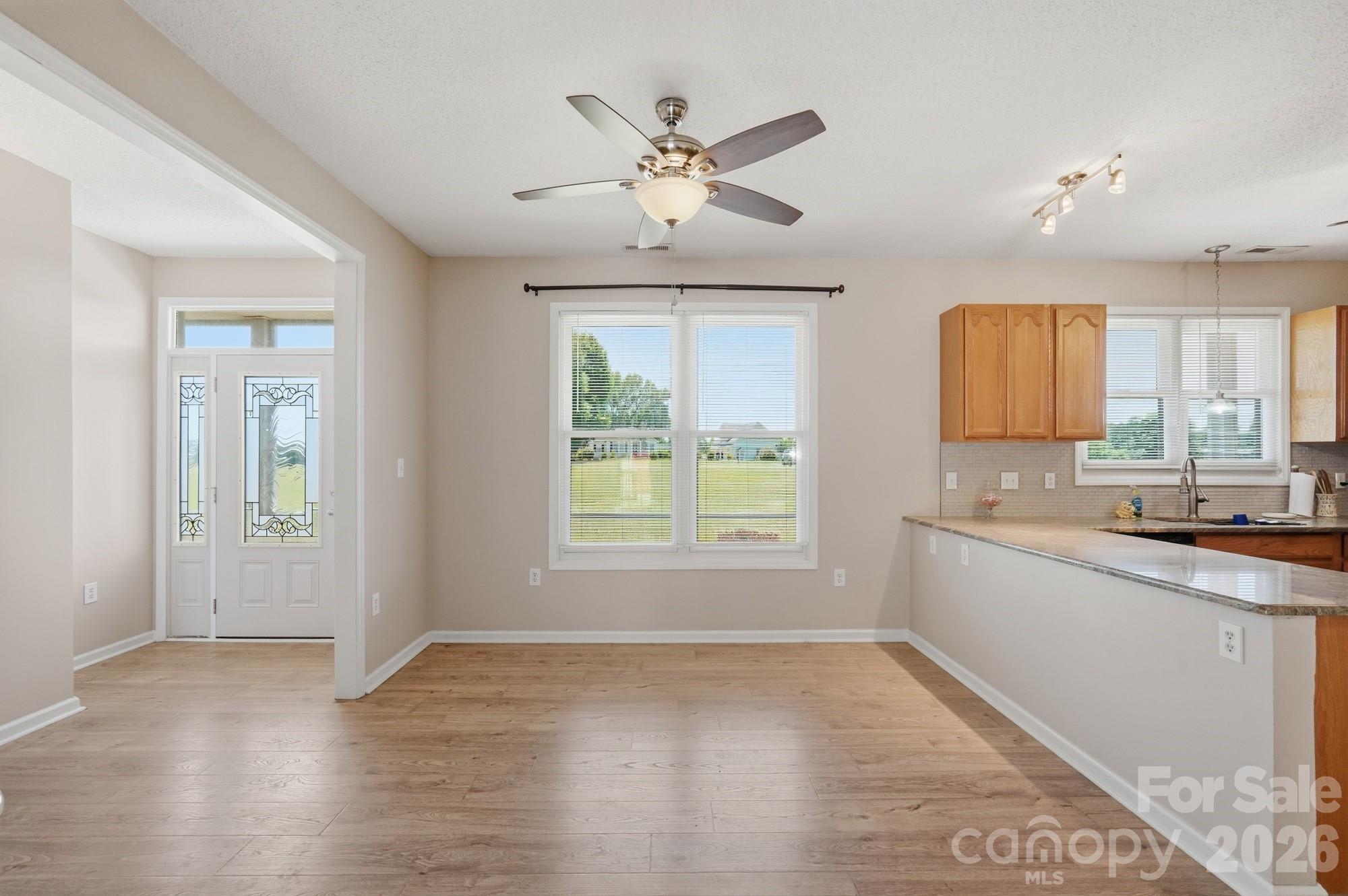 4415 Old Monroe Marshville Road Wingate, NC 28174 - Photo 7 of 28 a view of a kitchen with a sink and cabinet area