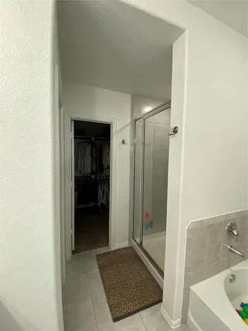 a bathroom with a sink and shower