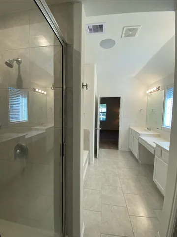 a view of a room with wooden floor