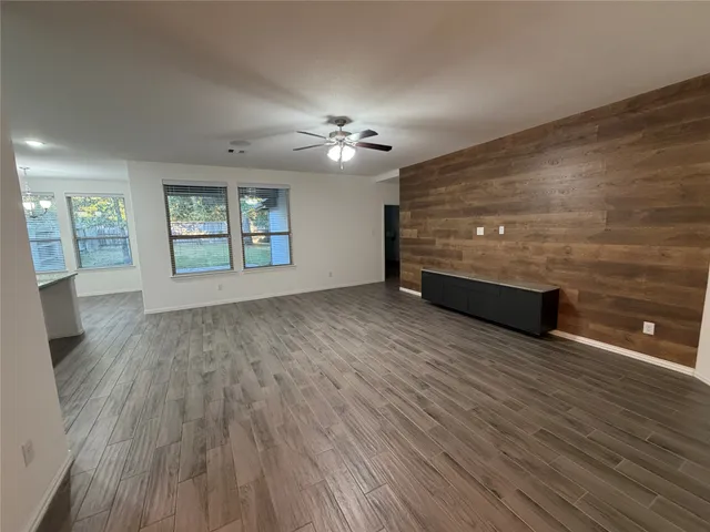 a house that has a tree in front of it