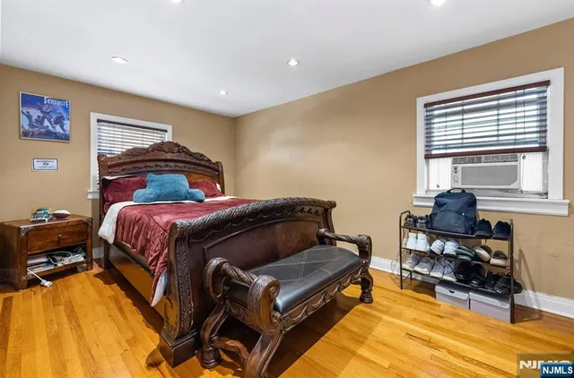 a bed room with a bed and a chair