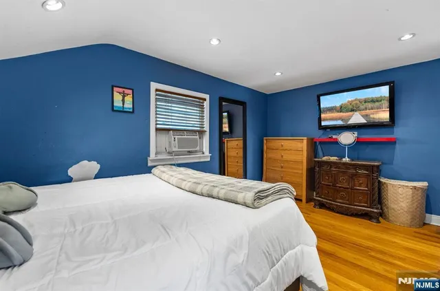 a bedroom with a bed and furniture