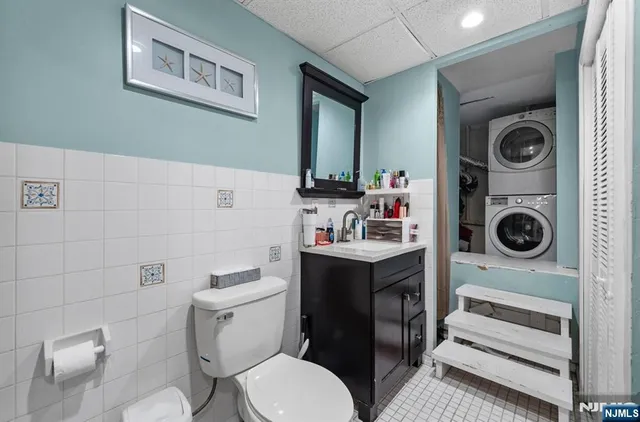 a bathroom with a toilet sink and vanity