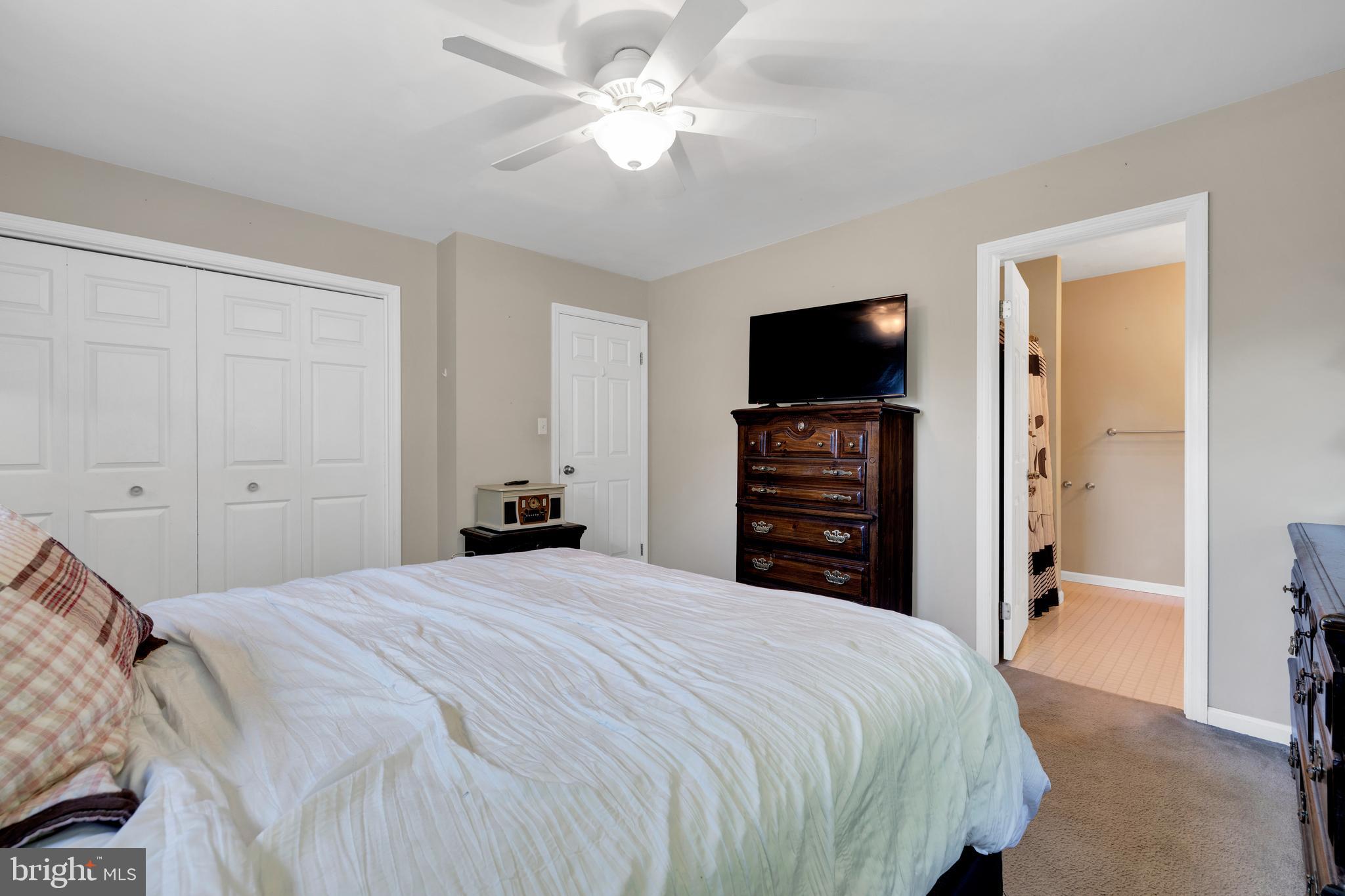 97 Bertolet Mill Road Oley, PA 19547 - Photo 17 of 35 a bedroom with a bed and a television