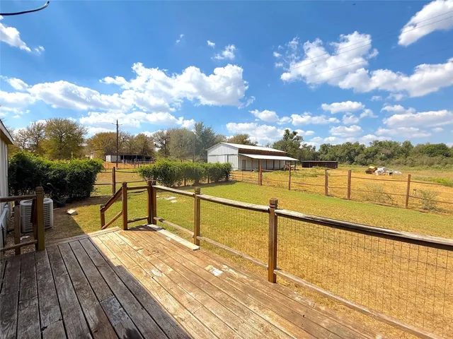 a view of a swimming pool with a chair