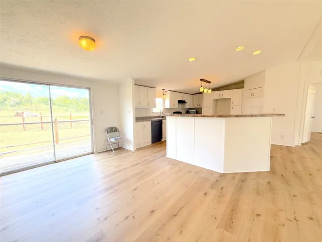 a kitchen with a sink stove and refrigerator