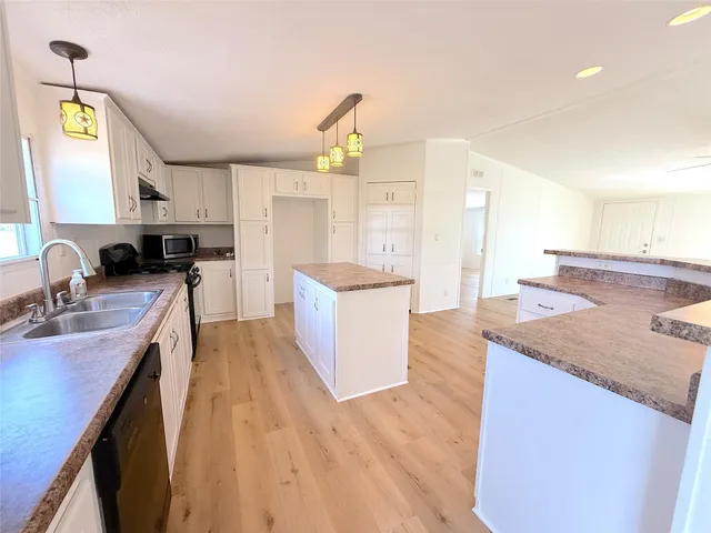 a kitchen with a table and chairs in it
