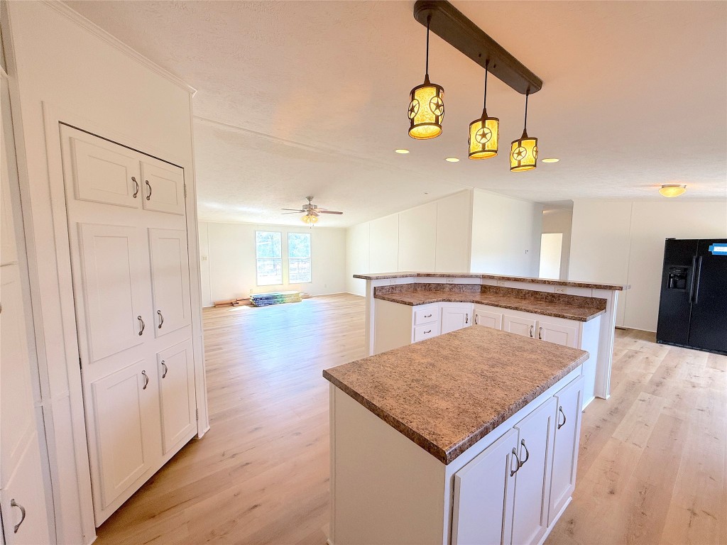 3063 County Road 484 Elgin, TX 78621 - Photo 16 of 29 a kitchen with a table and chairs in it