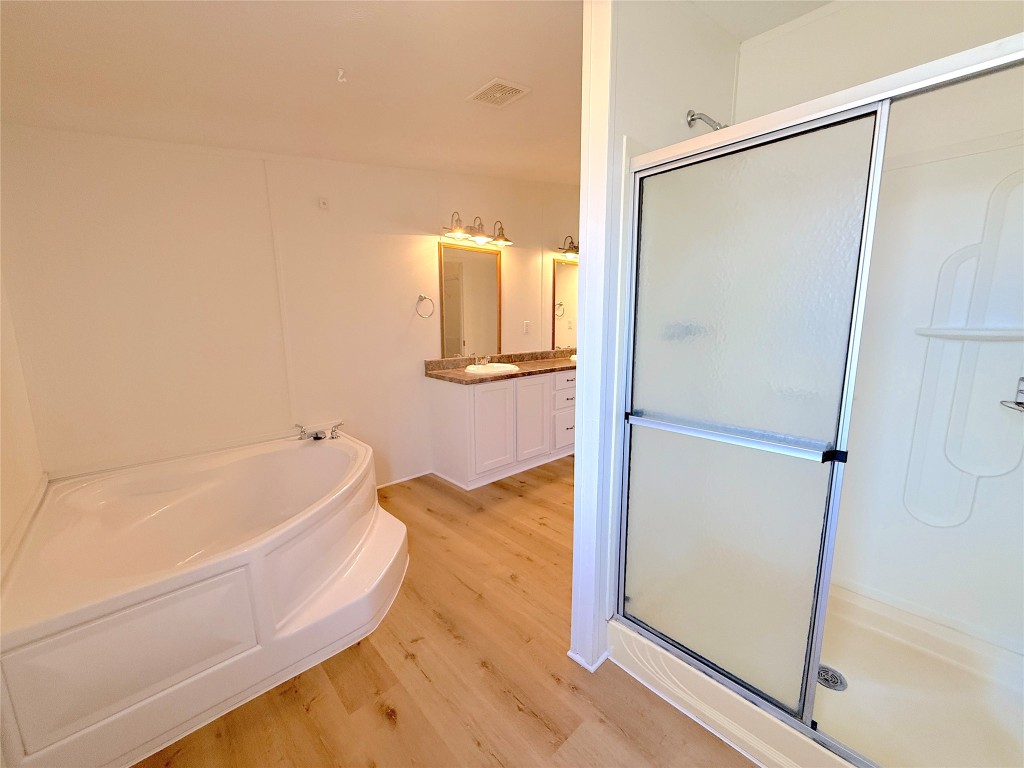 3063 County Road 484 Elgin, TX 78621 - Photo 21 of 29 a bathroom with a tub and a shower