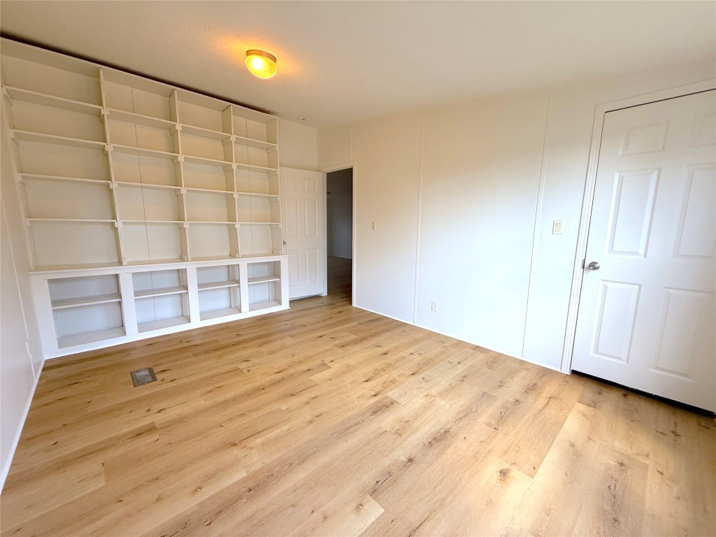 3063 County Road 484 Elgin, TX 78621 - Photo 22 of 29 a view of empty room with wooden floor and fan