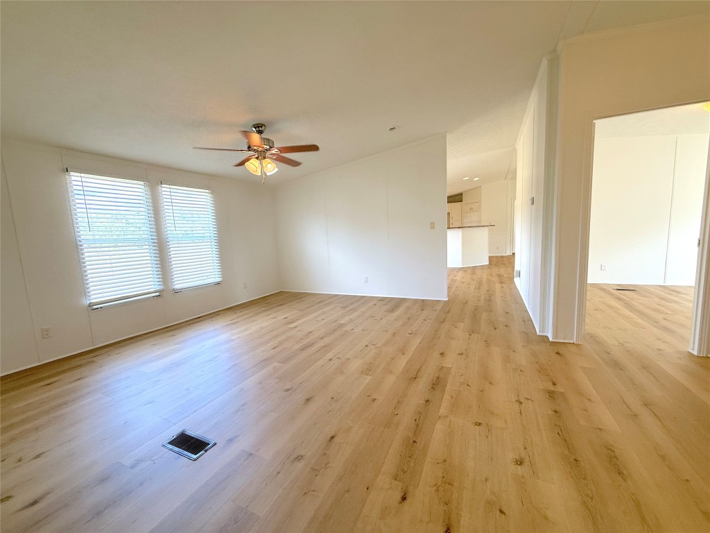 3063 County Road 484 Elgin, TX 78621 - Photo 25 of 29 an empty room with wooden floor and windows