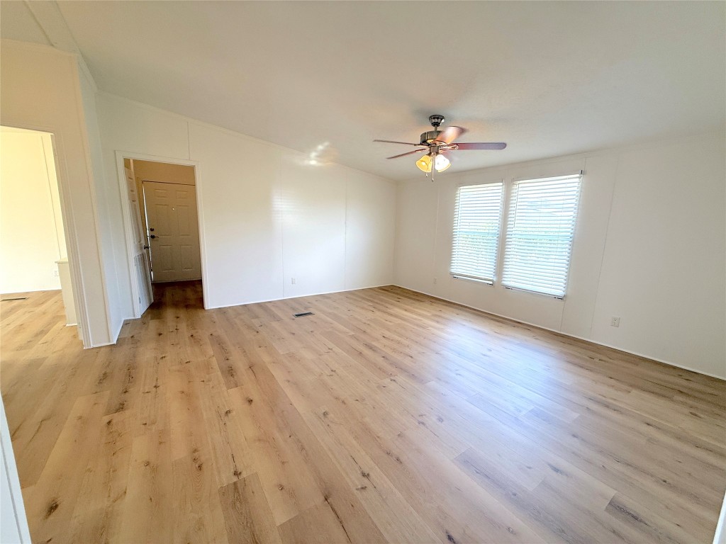 3063 County Road 484 Elgin, TX 78621 - Photo 26 of 29 wooden floor in an empty room with a window