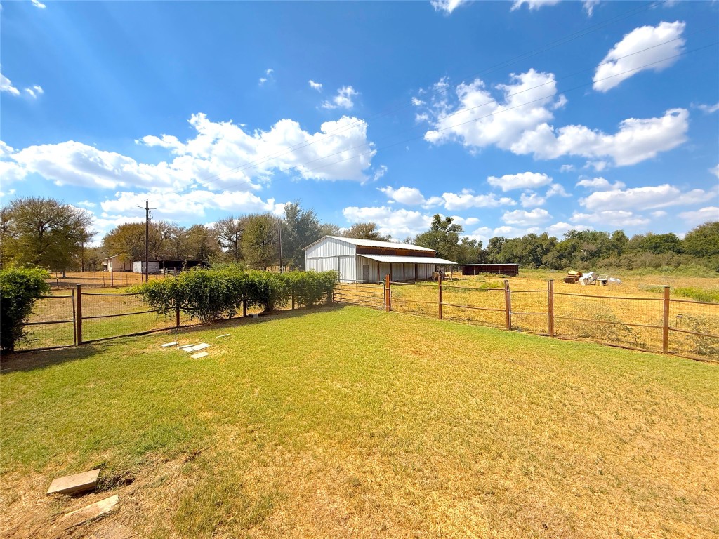 3063 County Road 484 Elgin, TX 78621 - Photo 27 of 29 a view of a swimming pool with an outdoor seating