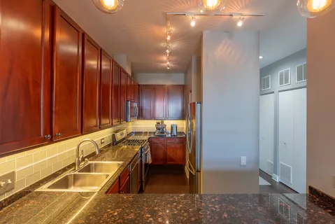 a kitchen with a sink and cabinets