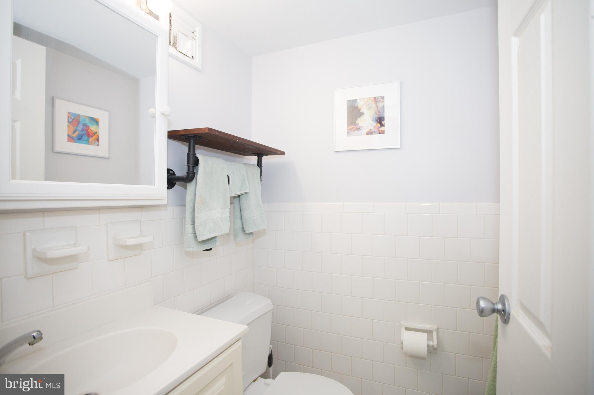 2304 Riddle Avenue, Unit 307 Wilmington, DE 19806 - Photo 15 of 23 a bathroom with a toilet and a shower